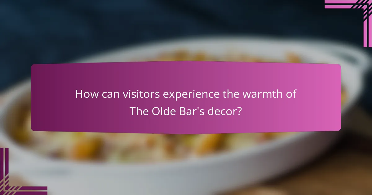 How can visitors experience the warmth of The Olde Bar's decor?